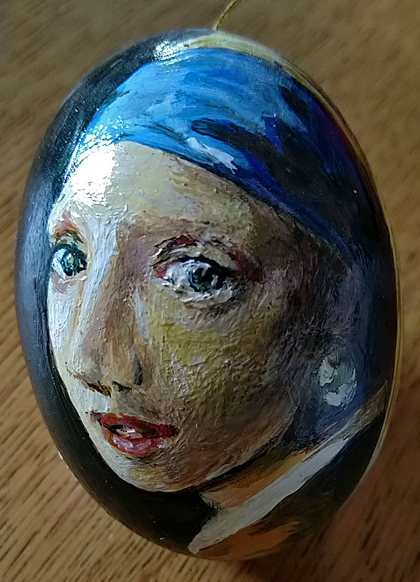 Meisje met parel op een ei geschilderd